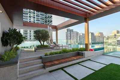 a patio with stairs and a view of a city at Trendy Loft Studio in Oxford Terrace JVC in Dubai