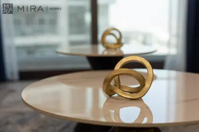 a gold pretzel sitting on top of a table at Mira Holiday Homes - Lovely new 1 bedroom in Downtown in Dubai