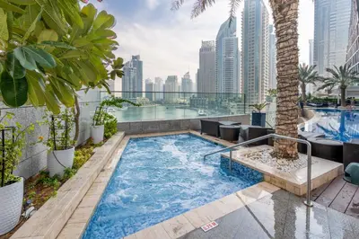 a swimming pool on the roof of a building at GuestReady - Charm stay in Dubai Marina in Dubai