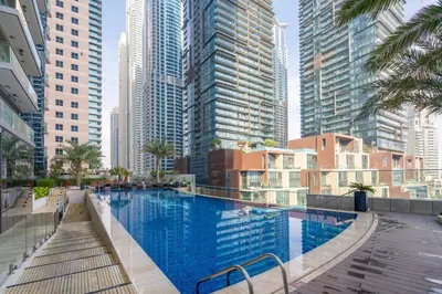 a swimming pool in a city with tall buildings at GuestReady - Charm stay in Dubai Marina in Dubai