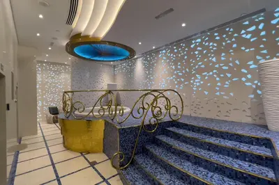 a room with a staircase with a blue light at GuestReady - Charm stay in Dubai Marina in Dubai