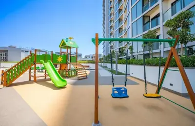 a playground with a slide in a building at Luxury apartment in Sobha Hartland Waves near Dubai mall and Burj Khalifa in Dubai