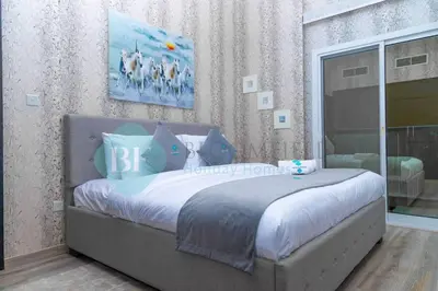 a bedroom with a large bed in a room at Bloomfields Cozy 1br In Silicon Oasis in Dubai