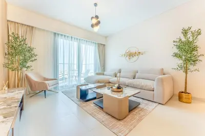 a living room with a couch and a table at 2 Br in in Burj Crown by Pk Holidays in Dubai