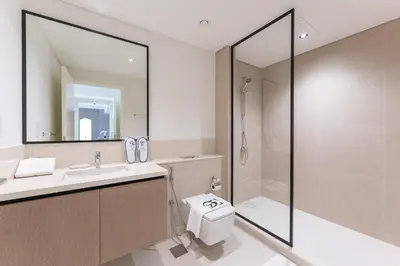 a bathroom with a shower and a toilet and a sink at 2 Br in in Burj Crown by Pk Holidays in Dubai