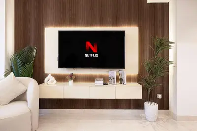 a living room with a tv on a wall at Luxurious New Studio! 2 Double Beds! Sleek Design & High-End Amenities in Dubai Downtown in Dubai