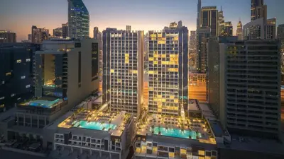 a view of a city skyline with tall buildings at Luxurious New Studio! 2 Double Beds! Sleek Design & High-End Amenities in Dubai Downtown in Dubai