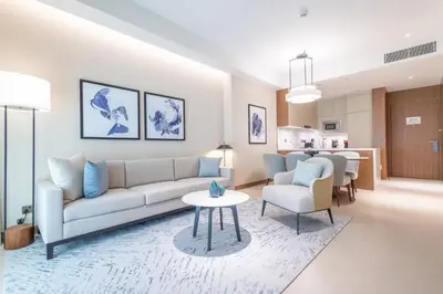 a living room with a couch and a table at Luxury 2BR at Address Opera Downtown City View in Dubai