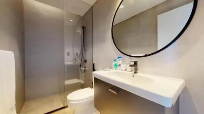a bathroom with a sink and a toilet and a mirror at Burj Khalifa & Lagoon View , Private 1 Bedroom in Dubai