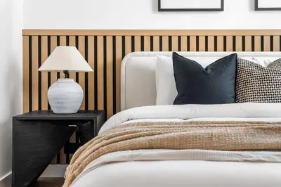 a bedroom with a bed and a lamp on a table at Silkhaus Chic 3BDR & maid room in Dubai Marina in Dubai