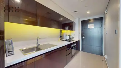 a kitchen with a sink and a counter top at Modern Studio in Majestine in Dubai