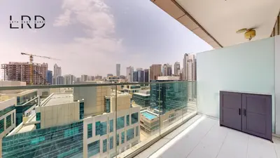 a large balcony with a view of the city at Modern Studio in Majestine in Dubai