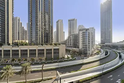 a highway in a city with tall buildings at Luxury 1BR apartment at Creek Edge Tower 2 in Dubai
