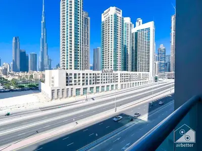 a view of a highway in a city with tall buildings at High End 1Bedroom with Balcony & View Dubai in Dubai