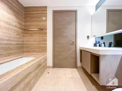 a bathroom with a tub and a sink at High End 1Bedroom with Balcony & View Dubai in Dubai