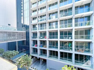 an apartment building with balconies and people on the balcony at High End 1Bedroom with Balcony & View Dubai in Dubai