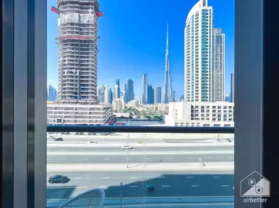 a view of a city skyline from a window at High End 1Bedroom with Balcony & View Dubai in Dubai
