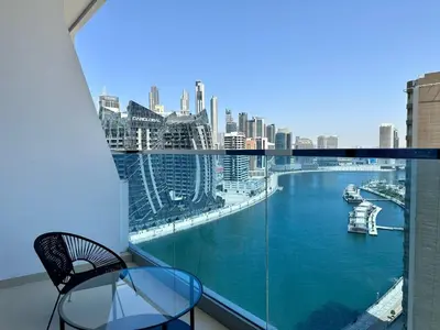 a balcony with a view of a river at Modern Furnished Studio with Canal View , High Floor in Dubai