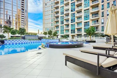 a swimming pool in the middle of a building at Burj Khalifa View 2BR Steps from Dubai Mall & Metro in Dubai