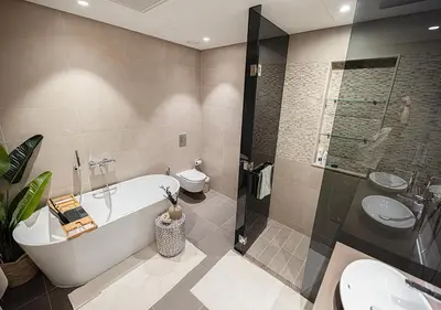 a bathroom with a tub and a toilet and a shower at Jumeirah Living Marina Gate - Golf & Skyline Views with Pool & Gym in Dubai