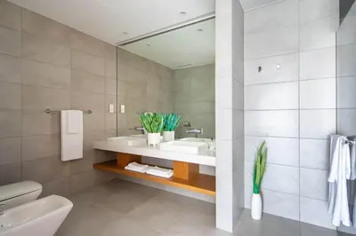a bathroom with a sink and a mirror at Frank Porter - The One JBR in Dubai