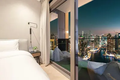 a bedroom with a view of a city at Marina Views in Walkable Location with Pool & Gym in Dubai