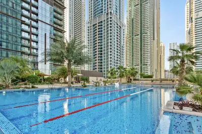 a large swimming pool in a city with tall buildings at Marina Views in Walkable Location with Pool & Gym in Dubai