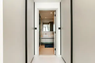 a door leading into a bathroom with a sink at Marina Vista Private Beach 2BR in Dubai