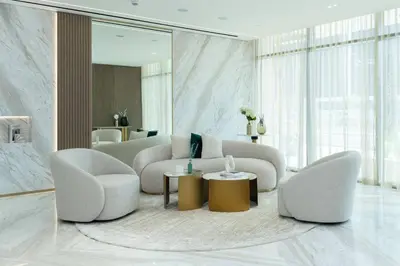 a living room with two chairs and a couch at Stylish 1br Apartment Jvc Balcony Parking in Dubai