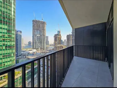 a balcony of a building with a view of a city at FIRST CLASS 1BR Charming City in Dubai