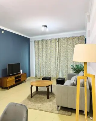 a living room with a couch and a table at Charming & Comfortable 1BR Jumeirah Bay X1 JLT in Dubai