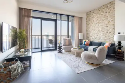 a living room with a couch and a table at Frank Porter - Creek Edge Tower 1 in Dubai
