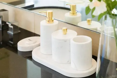 three rolls of toilet paper in front of a mirror at The Magnificent in Dubai