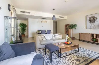 a living room with a couch and a table at Frank Porter - Murjan 1 in Dubai