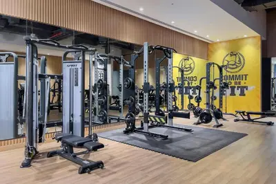 a gym with a lot of treadmills and weights at Seven Palm Residences Palm Jumeirah by Happy Season in Dubai
