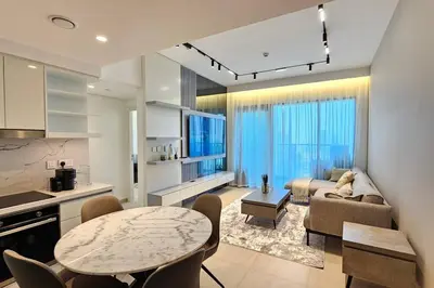 a living room with a couch and a table in a room at Downtown Dubai views 2 tower 1 in Dubai