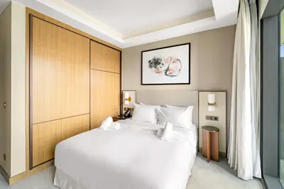 a bedroom with a large white bed in a room at Address Residence Dubai Opera 25 by Luxstay Holiday Homes in Dubai
