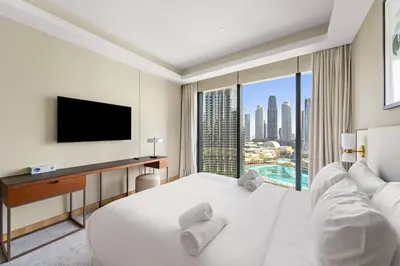a hotel room with a bed and a tv at Address Residence Dubai Opera 25 by Luxstay Holiday Homes in Dubai