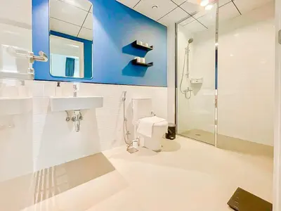 a bathroom with a toilet and a sink and a shower at Luxury 2 Bedroom in the Nook 1 next to Metro Energy in Dubai