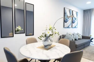 a living room with a table and a couch at Elite Residences Tower Dubai Marina by Happy Season in Dubai