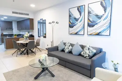 a living room with a couch and a table at Elite Residences Tower Dubai Marina by Happy Season in Dubai