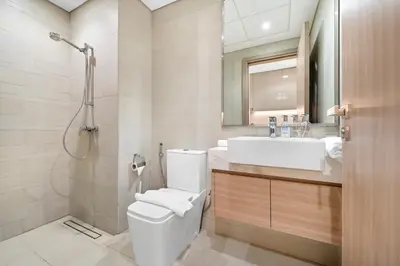 a bathroom with a toilet and a sink at Studio Azizi Riviera 28 Community View in Dubai
