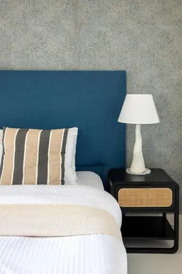 a bedroom with a bed and a lamp on a night stand at Frank Porter - Marina Vista tower 2 in Dubai