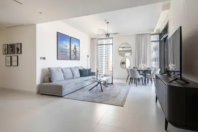 a living room with a couch and a table at Frank Porter - Marina Vista tower 2 in Dubai