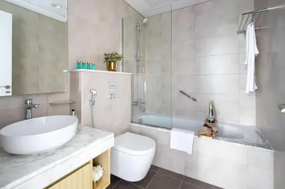 a bathroom with a sink and a toilet and a tub at Frank Porter - Aykon City Tower C in Dubai
