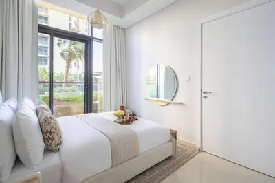 a bedroom with a bed and a large window at Frank Porter - Aykon City Tower C in Dubai