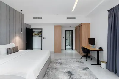 a bedroom with a bed and a desk with a computer at Bahar, Jumeirah Beach Residence JBR - Mint Stay in Dubai