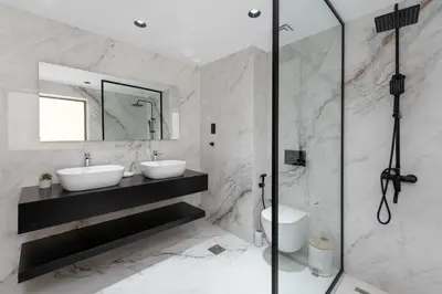 a bathroom with two sinks and a shower at Bahar, Jumeirah Beach Residence JBR - Mint Stay in Dubai