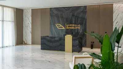 a lobby with a stage in the middle of a room at Stylish 1br Jvc Spacious Layout Pool View in Dubai