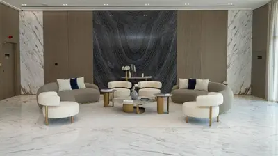 a living room with couches and chairs and a table at Stylish 1br Jvc Spacious Layout Pool View in Dubai